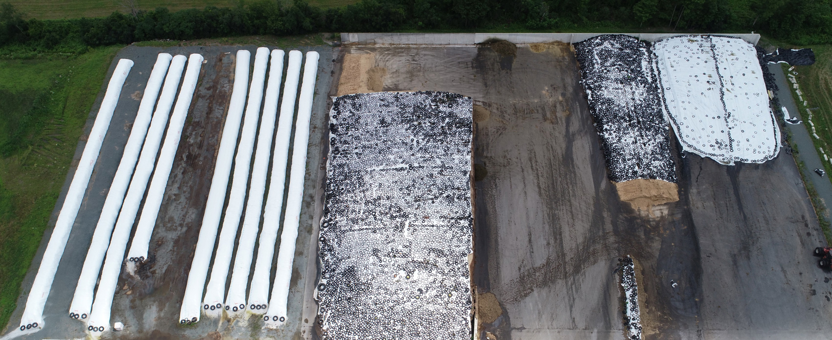 Aerial view of a dairy farm with silage piles being measured by drone